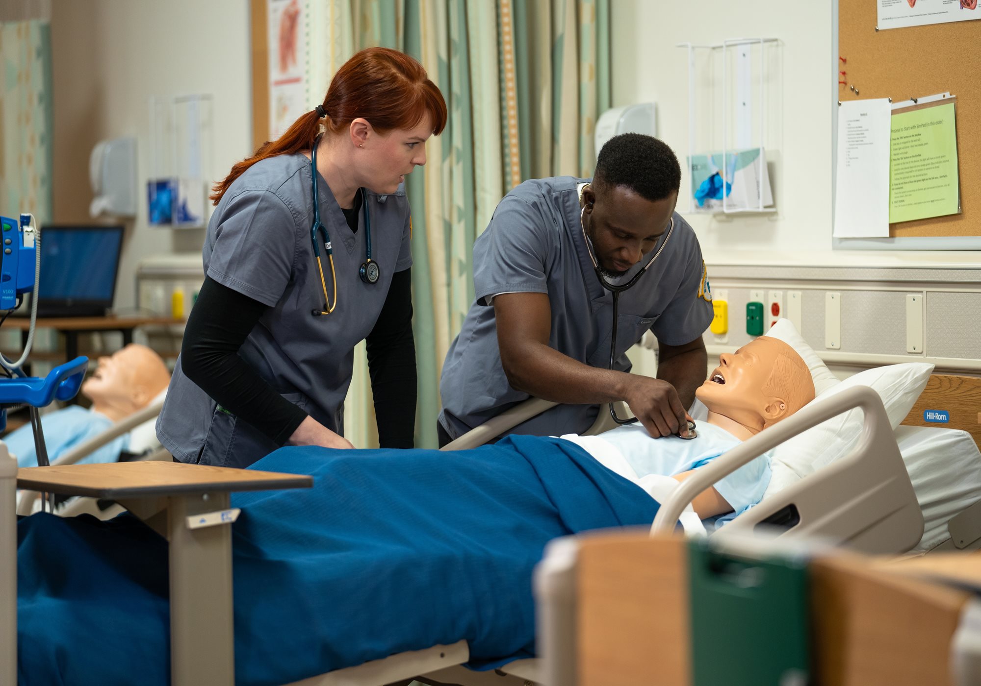 EKG Technicians working with CPR manikin