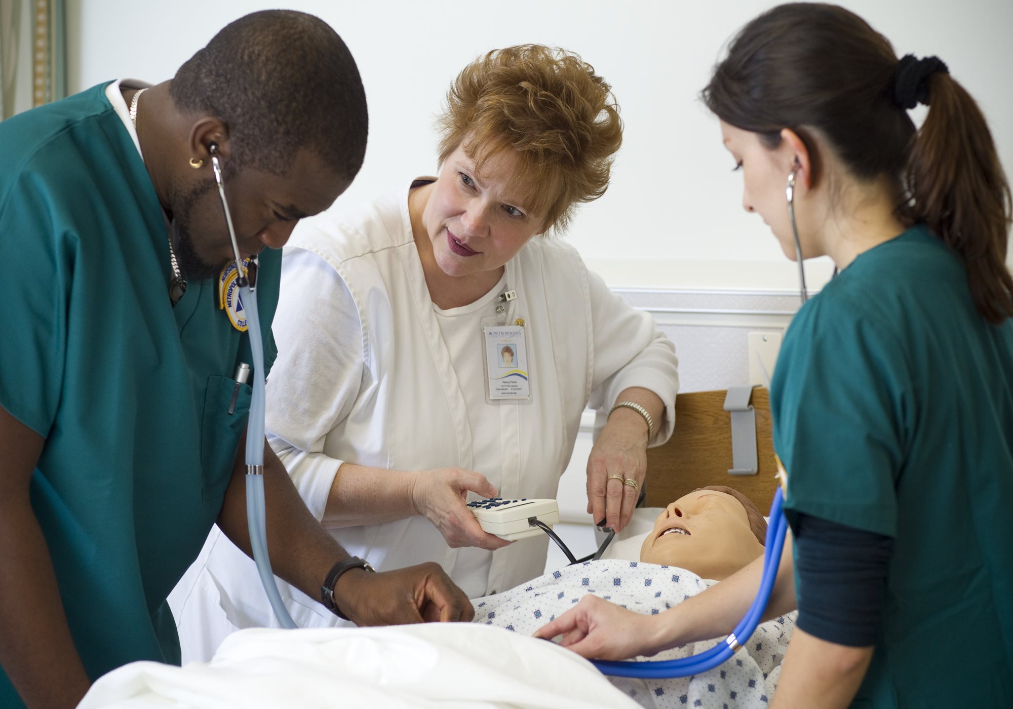 Instructor teaching students medical aide