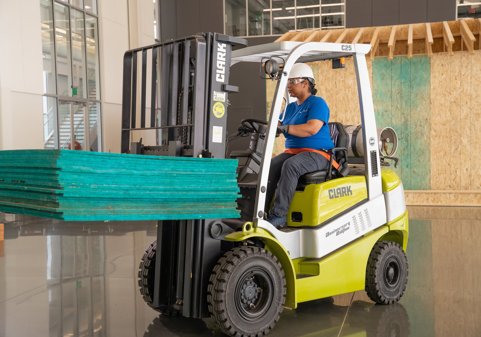 Female Student Operating Forklift