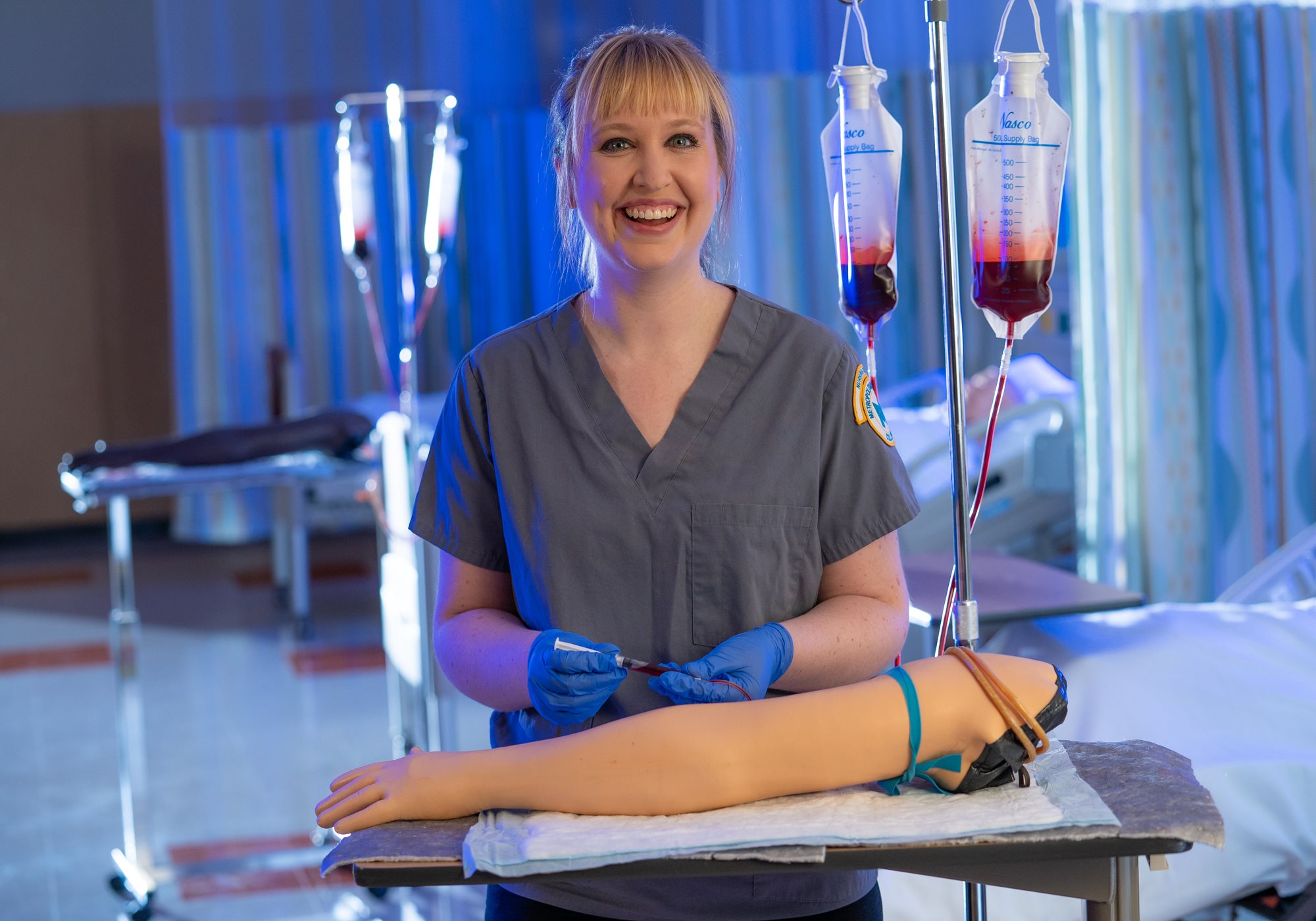 Smiling Phlebotomy Technician Collecting Blood