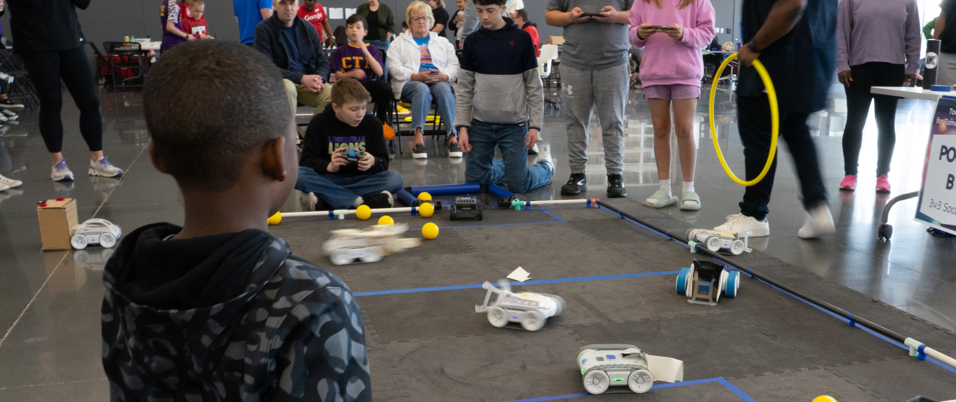 Elementary school students compete in a robotics competition at the Fort Omaha Campus