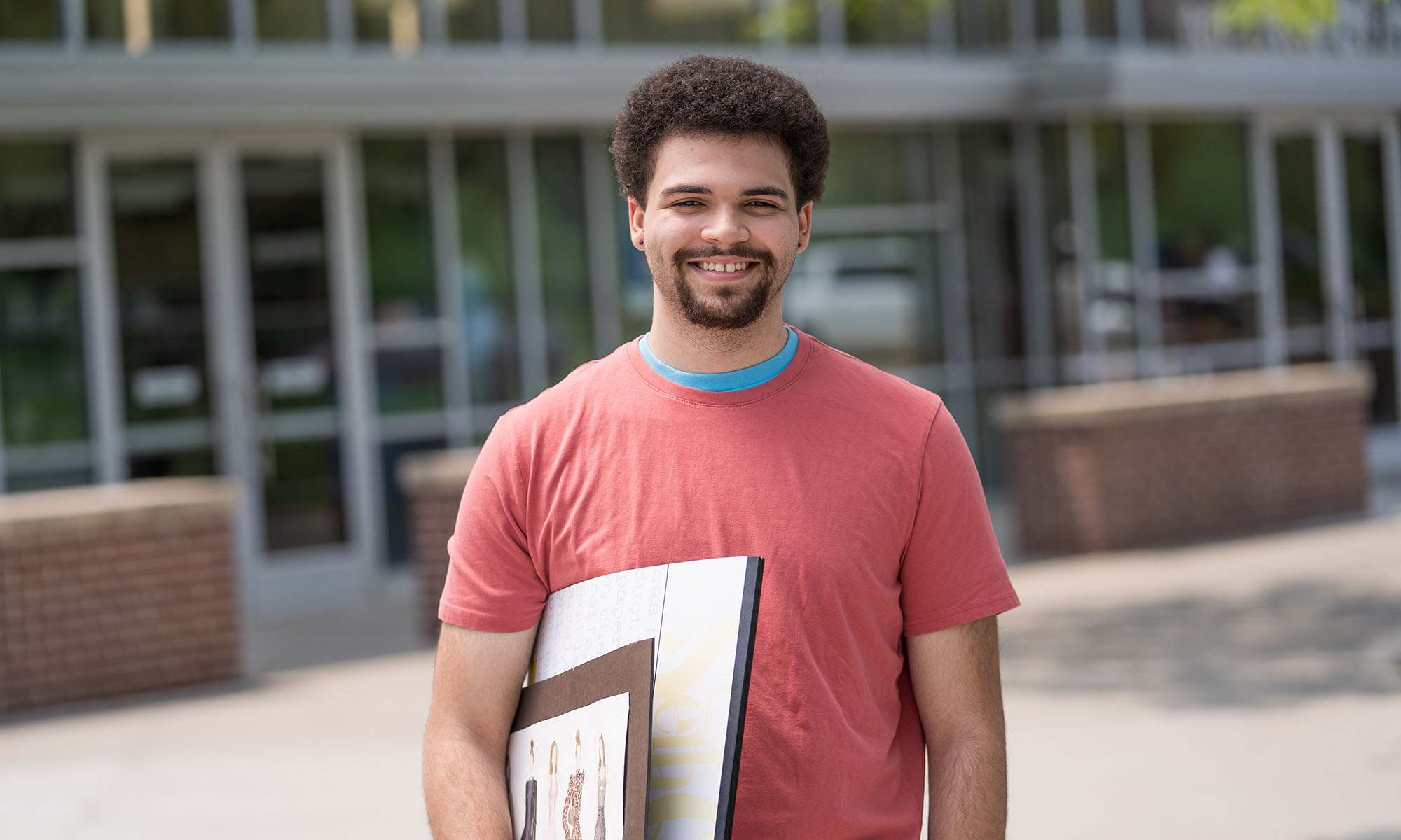 Student standing Infront of building